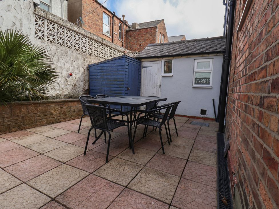 A patio with a table and chairs at 35 Moorland Road Scarborough