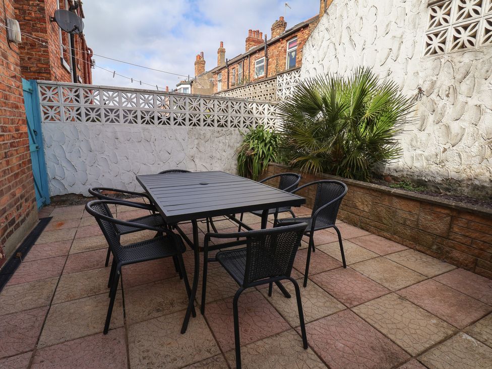 A garden with a table and chairs at 35 Moorland Road Scarborough