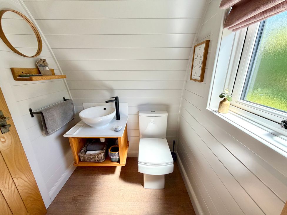 A bathroom with a sink and toilet at No Deer Ashbourne