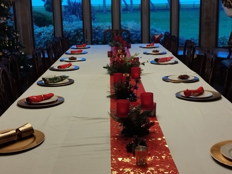 A dining room table set for a meal at Highcliffe Manor in Flamborough
