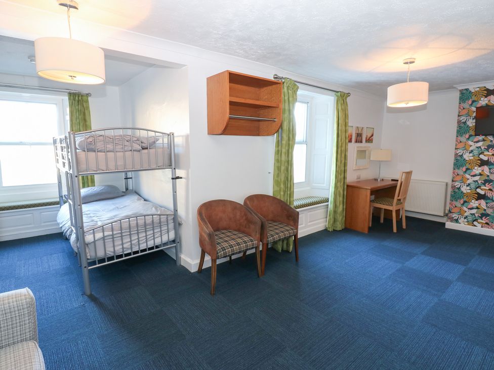 A bedroom with a bunk bed and a desk at Bedroom 1 in 