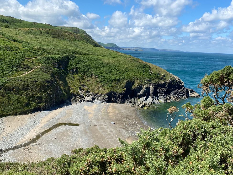 Coastline view with sand and ocean at Ty Bach Twt Synod Inn, near New Quay