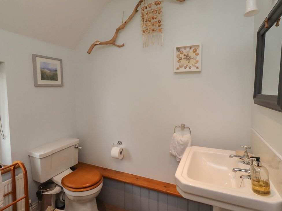 A bathroom with a sink and toilet at Rose House, Alnmouth