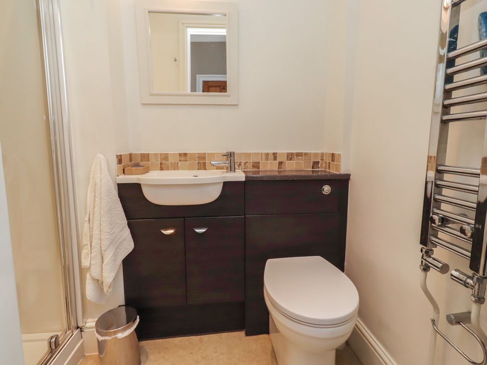 A bathroom with a sink and toilet at Rose House Alnmouth