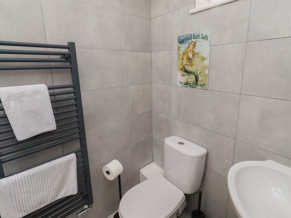 A bathroom with a sink and toilet at Rose House in Alnmouth
