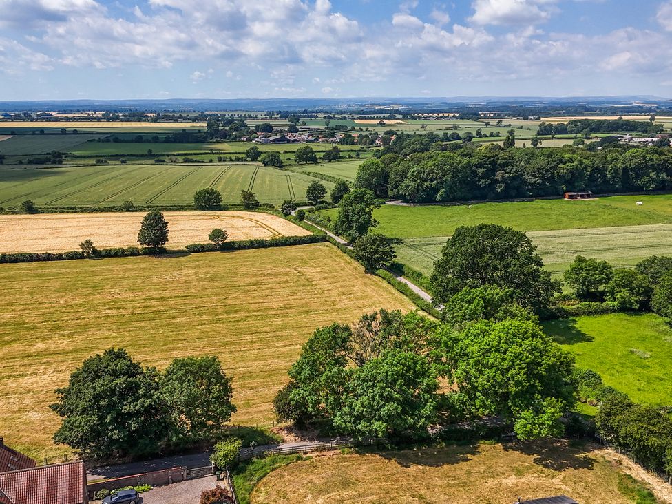 A view of fields and trees at The Stables in Thirsk