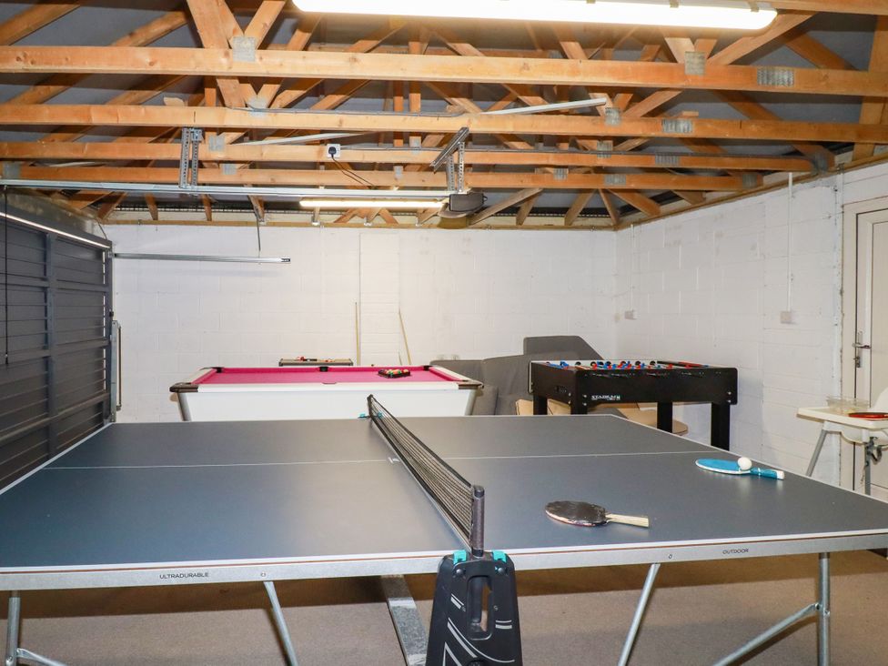 A game room with ping pong and pool tables at Lavender House Crantock
