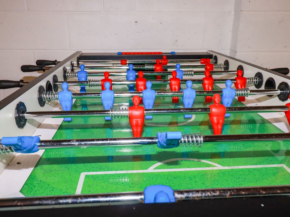 A foosball table with blue and red players at Lavender House Crantock