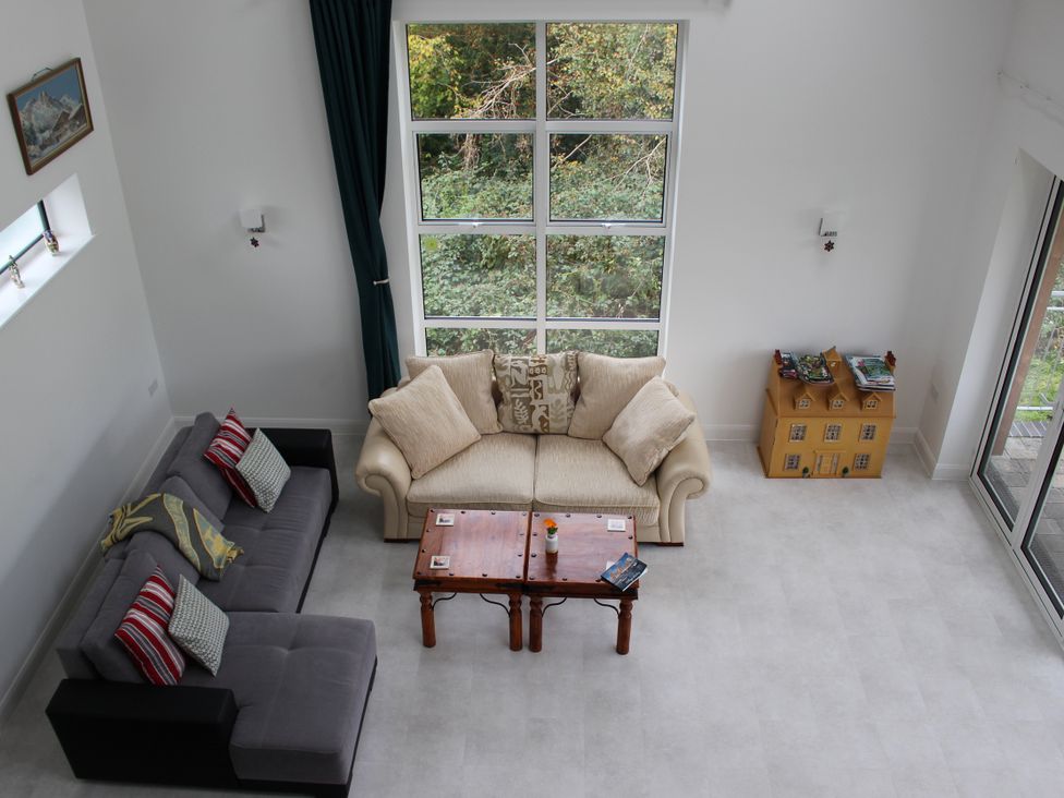 A living room with a couch and coffee table at Narracott Down South Molton