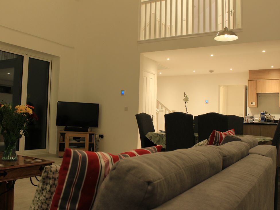 A living room with a sofa and television at Narracott Down South Molton