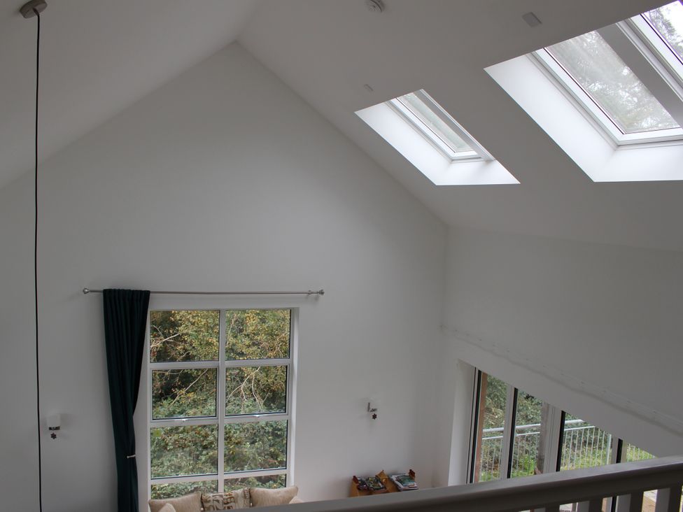 A living room with skylights and a window at Narracott Down in South Molton