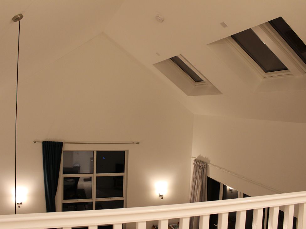 A room with skylights and curtains at Narracott Down, South Molton