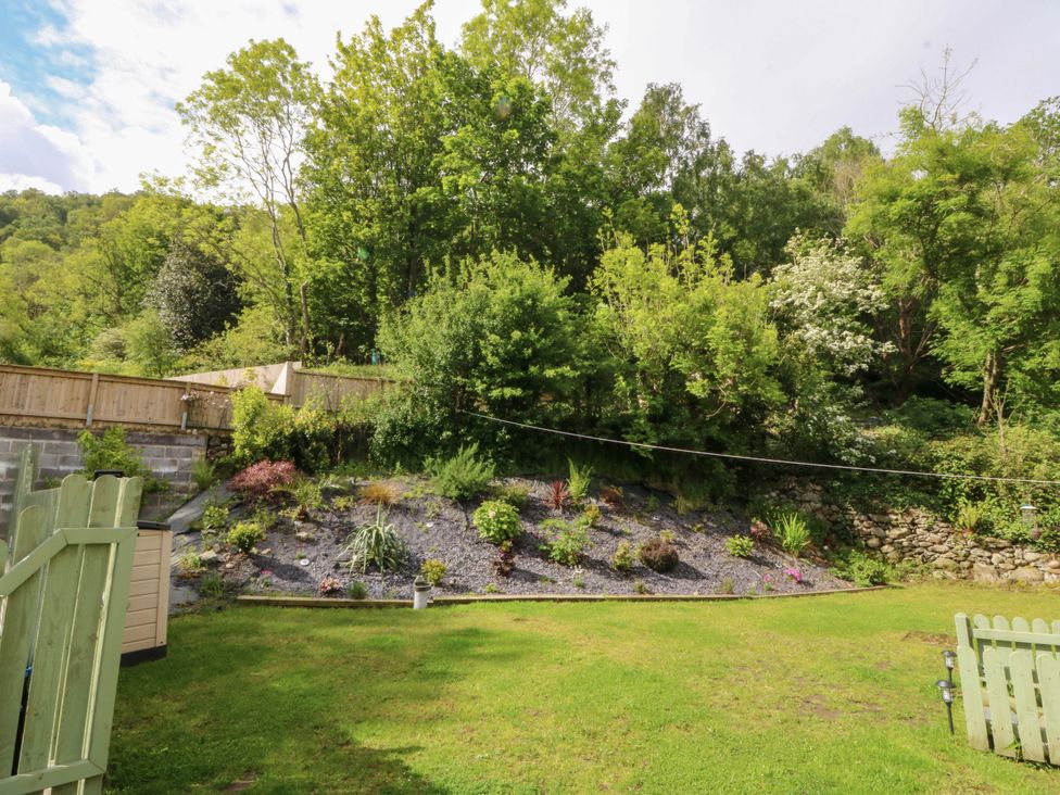 A garden with a sloped area featuring plants at Old Chapel House Abergwyngregyn near Llanfairfechan