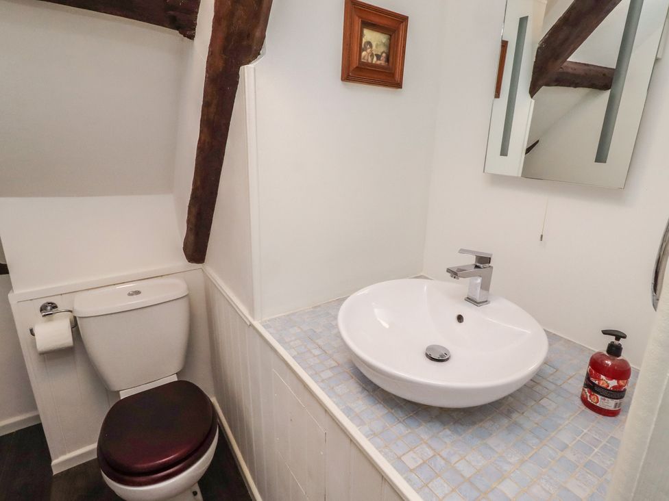 A bathroom with sink and toilet at The Coach House Crookham near Cornhill-On-Tweed