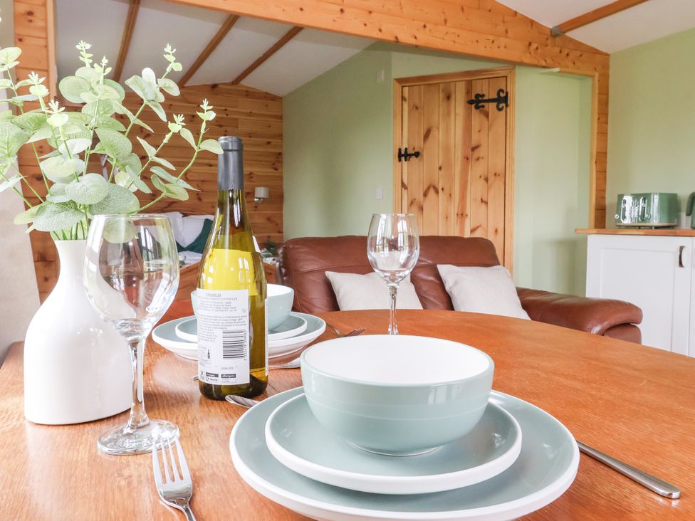A dining room with table setting and seating at Lodge 2 in York