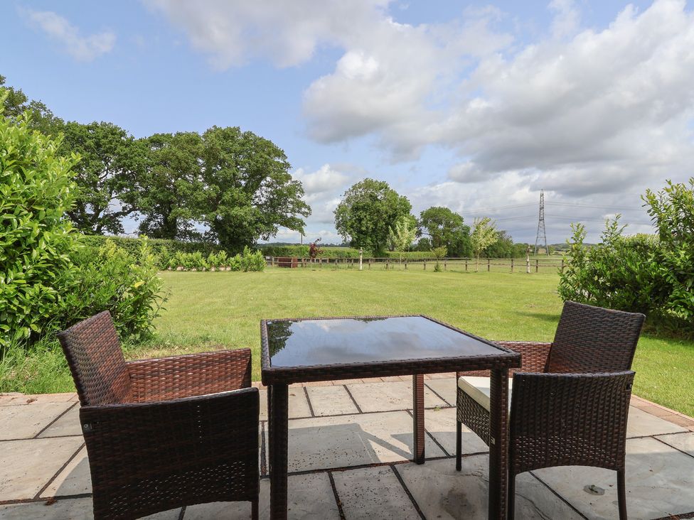 An outdoor area with a table and chairs at Lodge 3 in Strensall