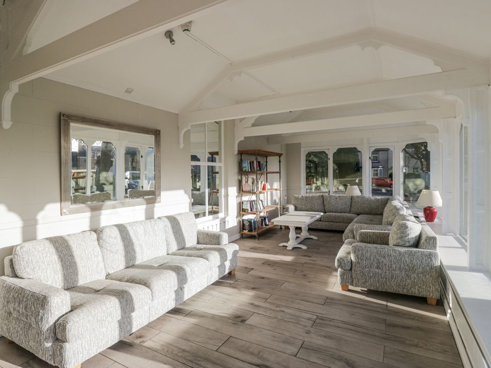 A living room with sofas and bookshelves at Valley View in Dalton-In-Furness
