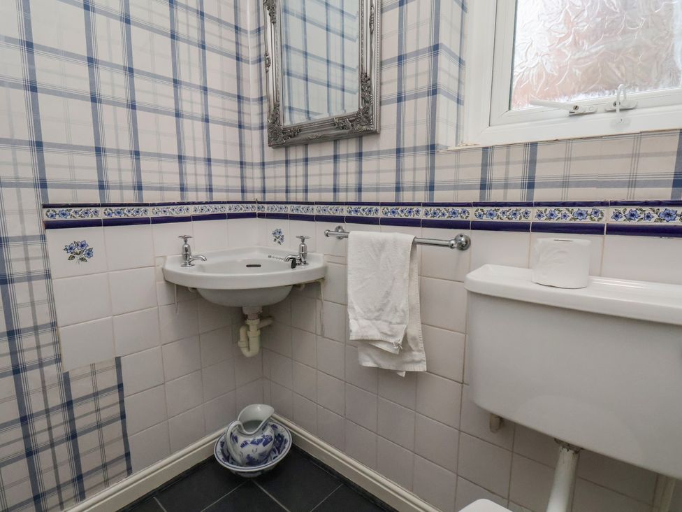 A bathroom with sink and toilet at Bridlington Bay House in Bridlington