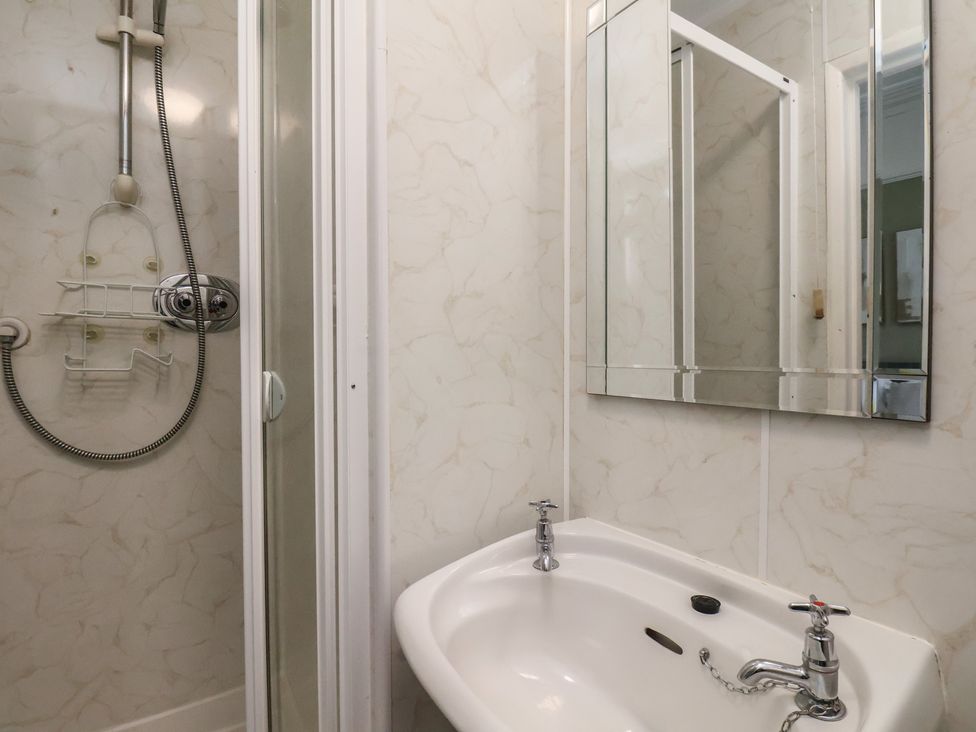 A bathroom with a shower and a sink at Bridlington Bay House in Bridlington