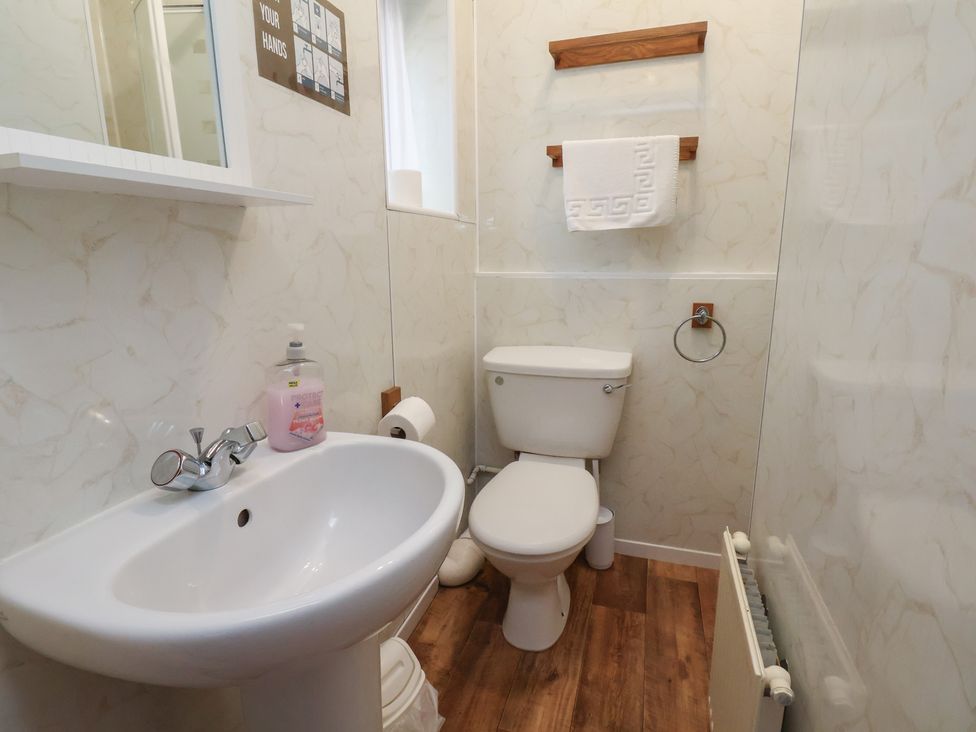 A bathroom with a sink and toilet at Bridlington Bay House in Bridlington