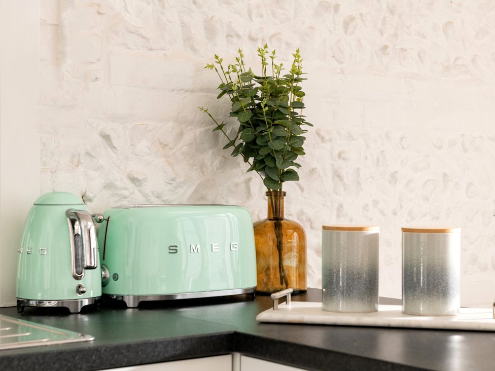 A kitchen with a kettle and toaster at Primrose in Blandford Forum