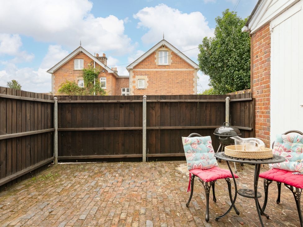 An outdoor area with a table and chairs at Primrose Blandford Forum