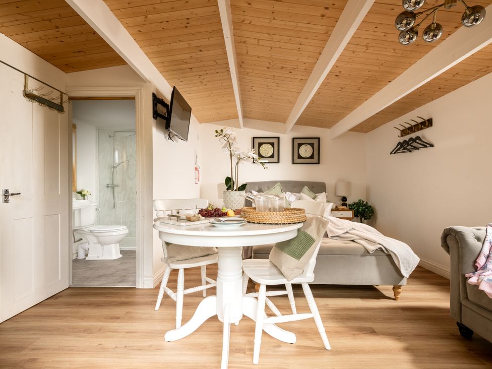 A studio room with a table and chairs at Hazel in Blandford Forum