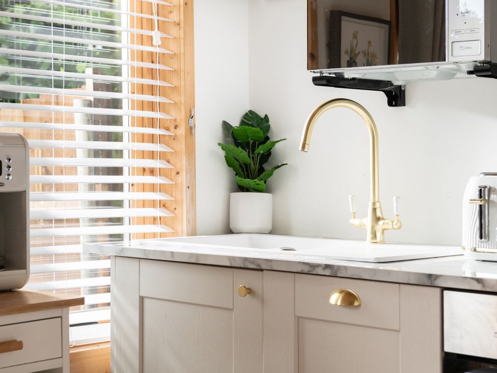A kitchen with a sink and faucet at Hazel in Blandford Forum