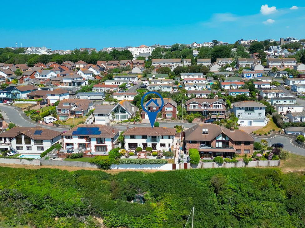Aerial view of residential area with houses and gardens at Newquay Tamarisk Lodge on the Gannel in Newquay