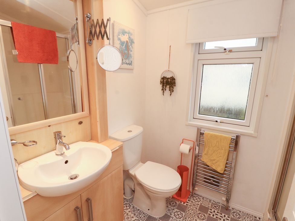 A bathroom with sink and toilet at Rosie's Zen Den High Hesket near Armathwaite