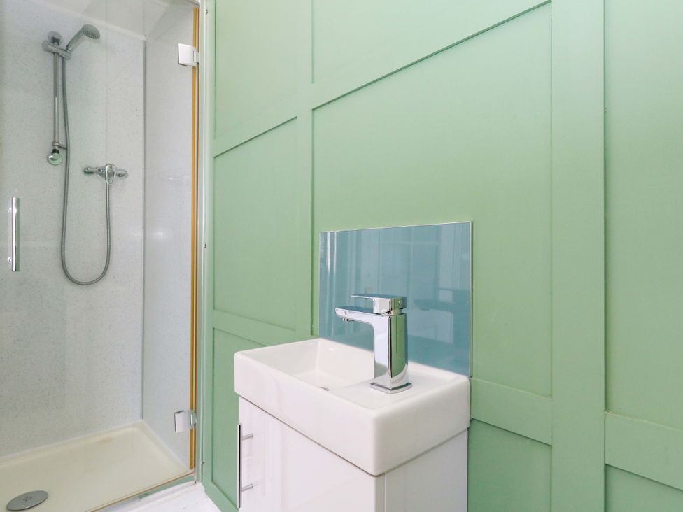 A bathroom featuring a shower and a sink at The Old Post Office in Weymouth