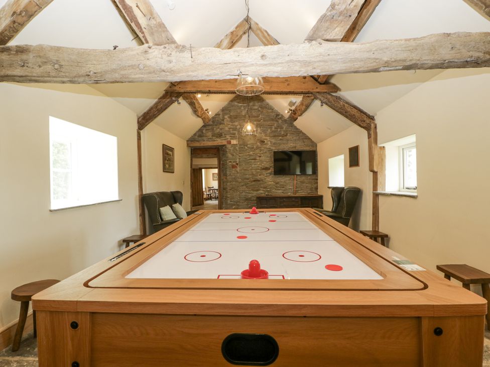 A game room with an air hockey table at Evenjobb Court Farmhouse in Evenjobb near Presteigne