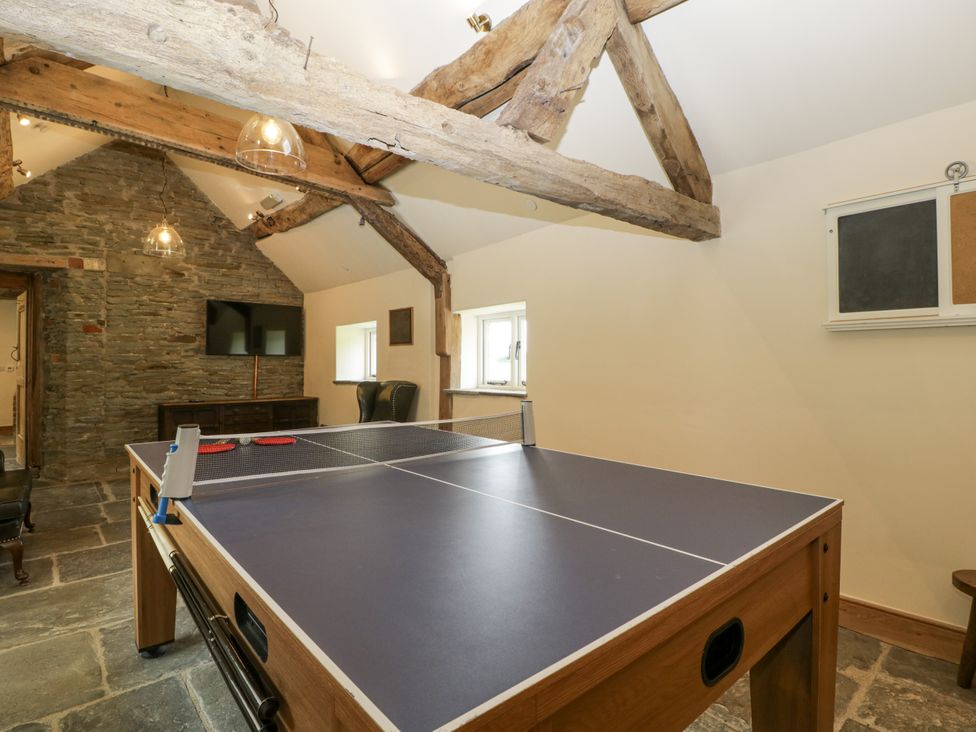 A recreation room with a table tennis table at Evenjobb Court Farmhouse Evenjobb near Presteigne