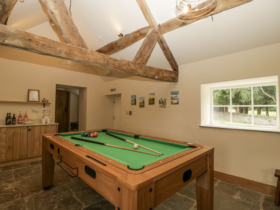 A games room with a pool table and bar cabinet at Evenjobb Court Farmhouse Evenjobb near Presteigne