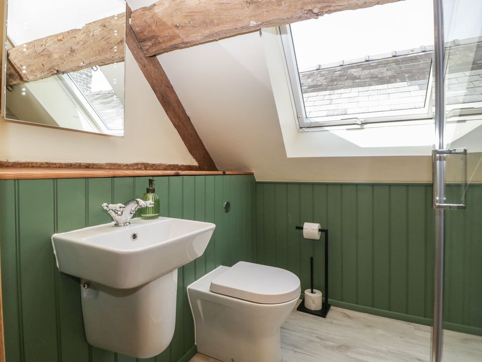 A bathroom with a sink and toilet at Evenjobb Court Farmhouse Evenjobb near Presteigne