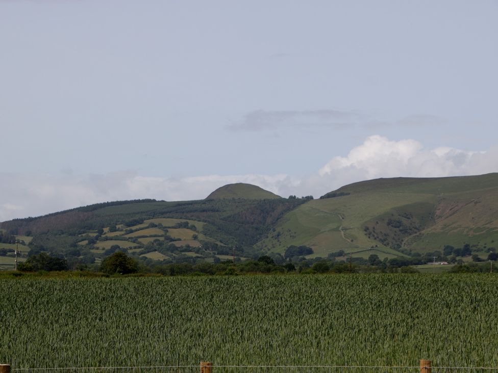A view of hills and a field at Evenjobb Court Farmhouse near Presteigne