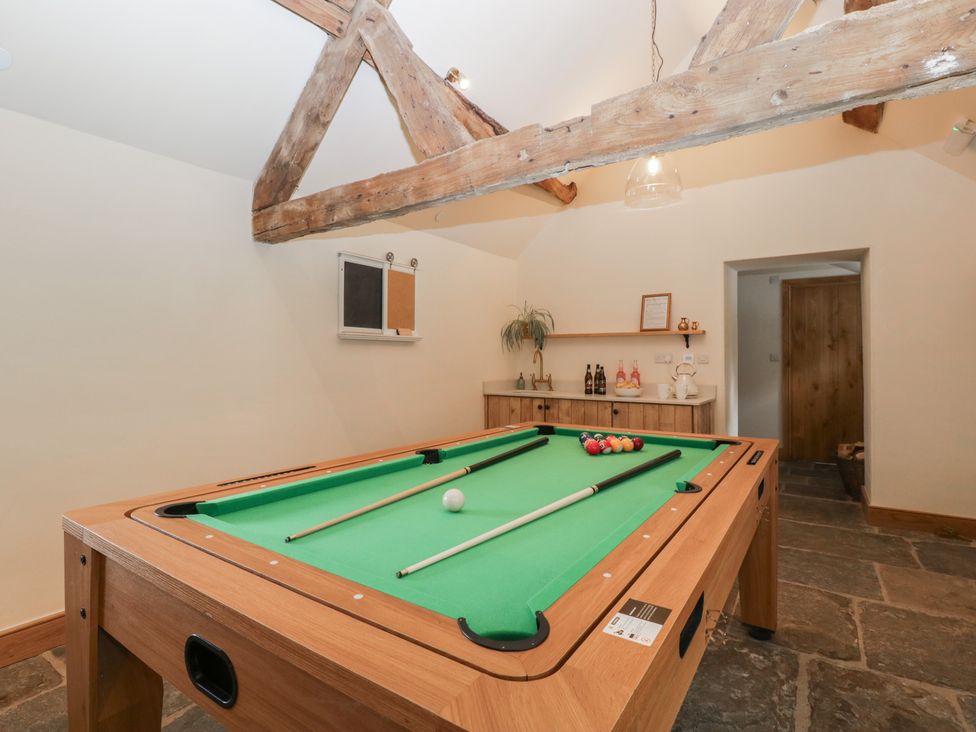 A game room with a pool table and a shelf at Evenjobb Court Farmhouse Evenjobb near Presteigne
