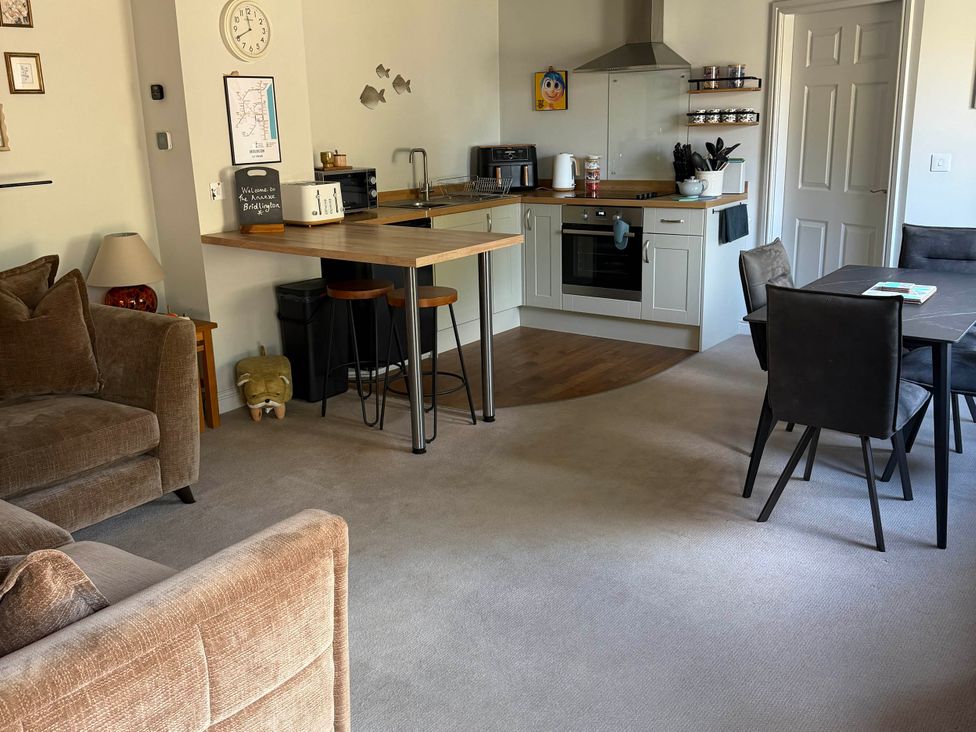 A living room with a kitchen area at The Annexe Bridlington