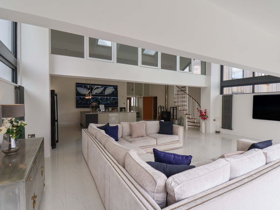 A living room with a sofa and television at Mill Cottage in Walkington
