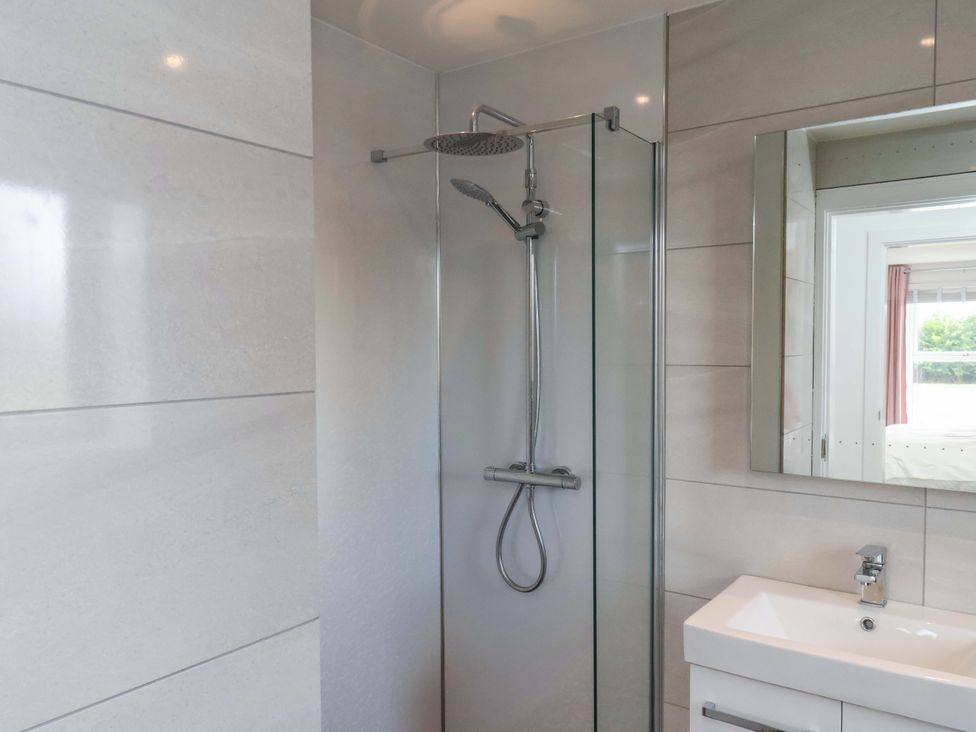 A bathroom with a shower and sink at Mill Cottage Walkington