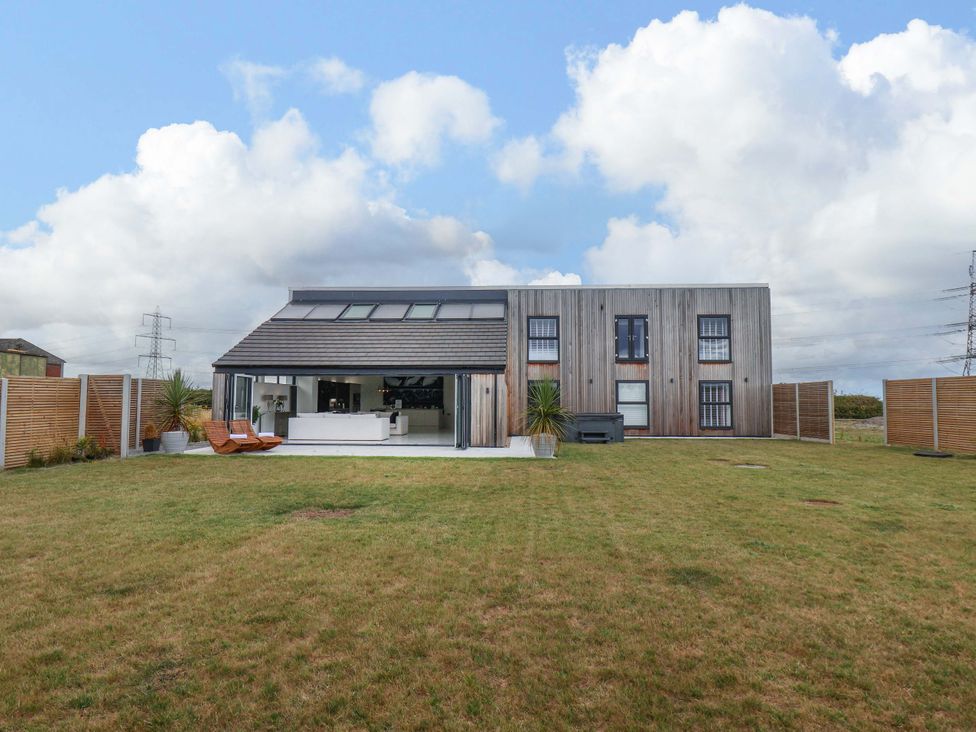 A house with a garden and patio area at Mill Cottage in Walkington