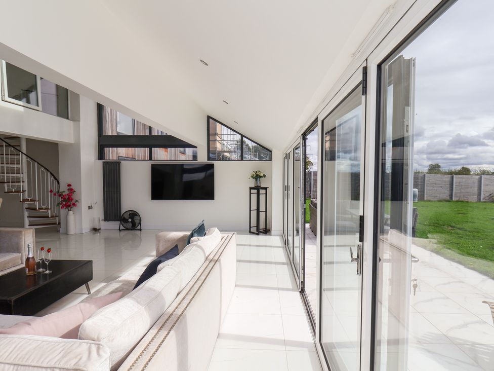 A living room with a sofa and television at Meadow View Beverley near Walkington