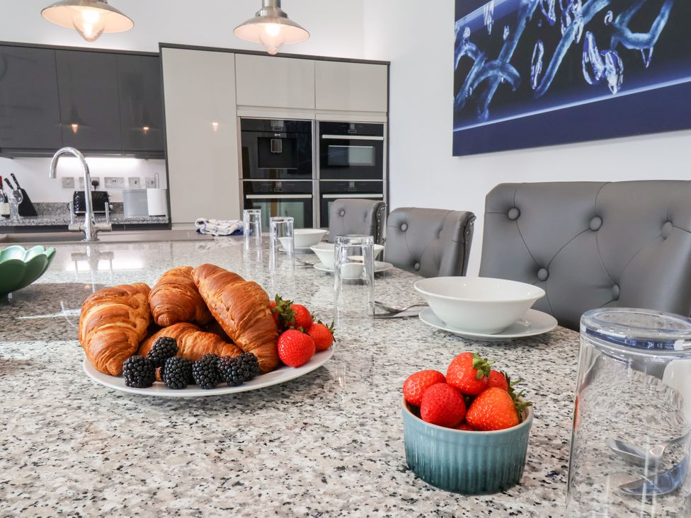 A kitchen with a table set for breakfast at Meadow View Beverley near Walkington