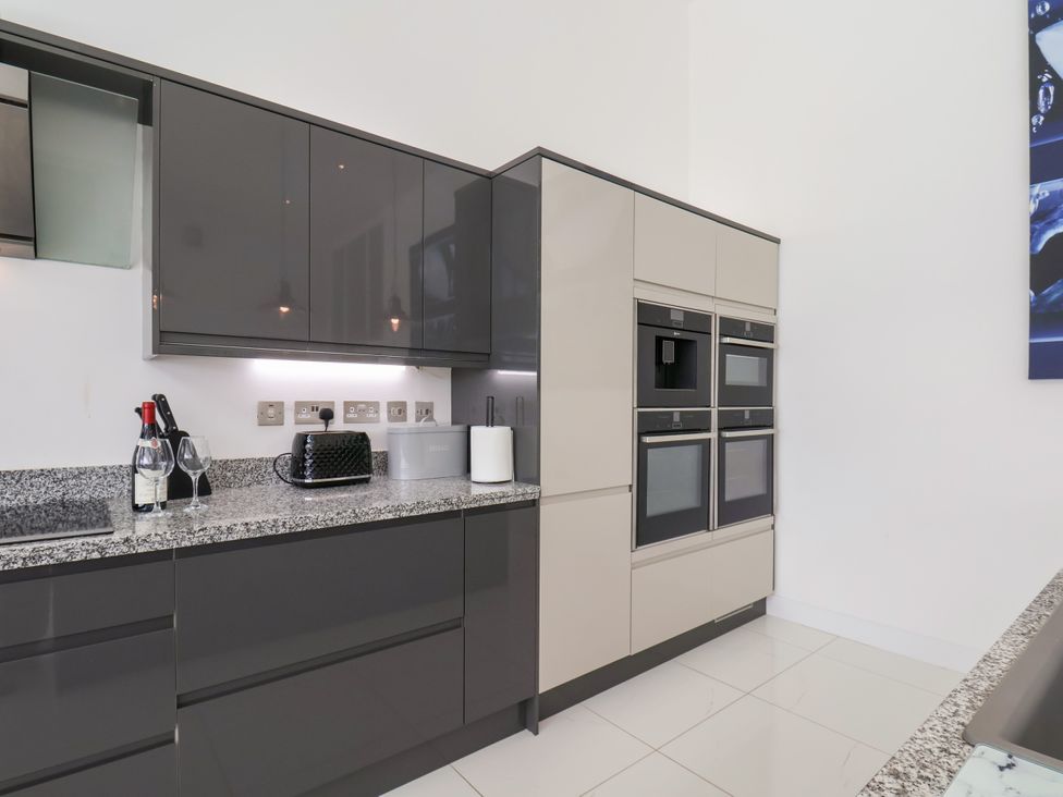 A kitchen with cabinets, oven, and appliances at Meadow View in Beverley near Walkington