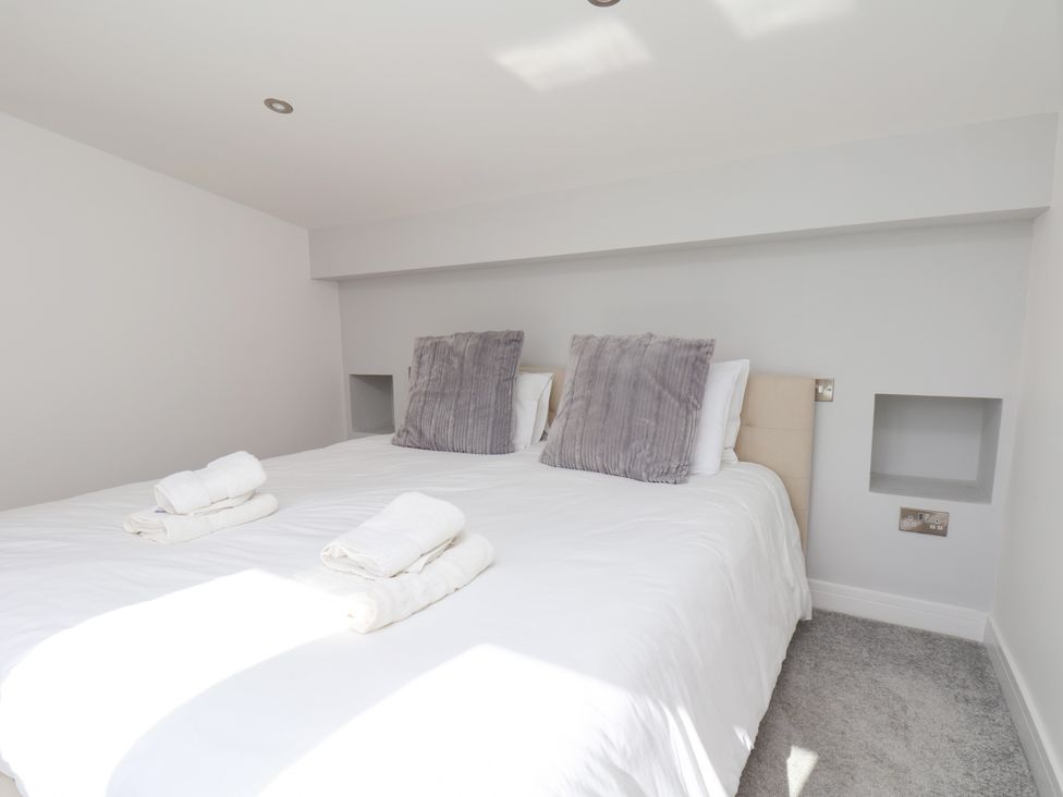 A bedroom with a bed and pillows at Meadow View Beverley near Walkington
