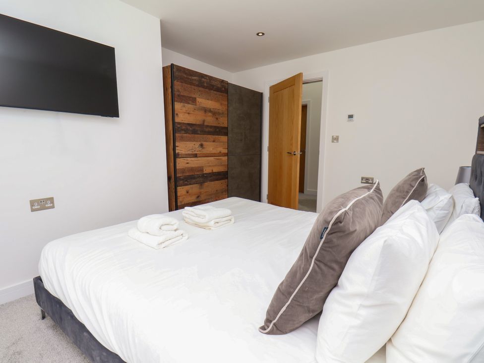 A bedroom with a bed and television at Meadow View Beverley near Walkington