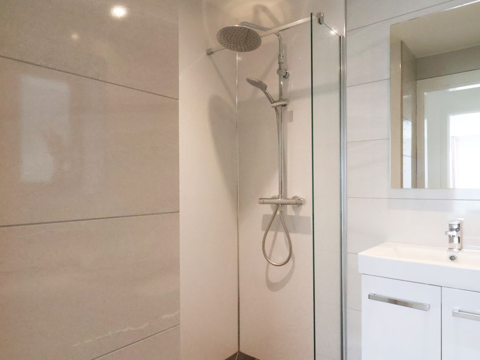A bathroom with a shower and a sink at Meadow View Beverley near Walkington