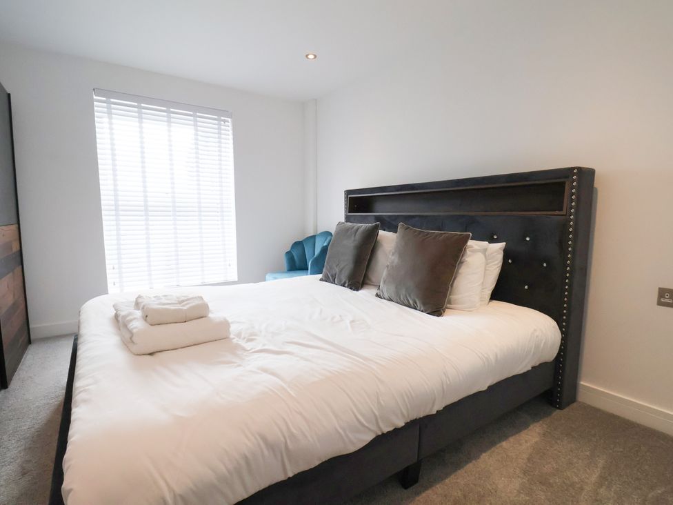 A bedroom with a bed and towels at Meadow View Beverley near Walkington