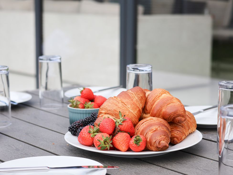 A plate of croissants and strawberries on a table at Meadow View Beverley near Walkington