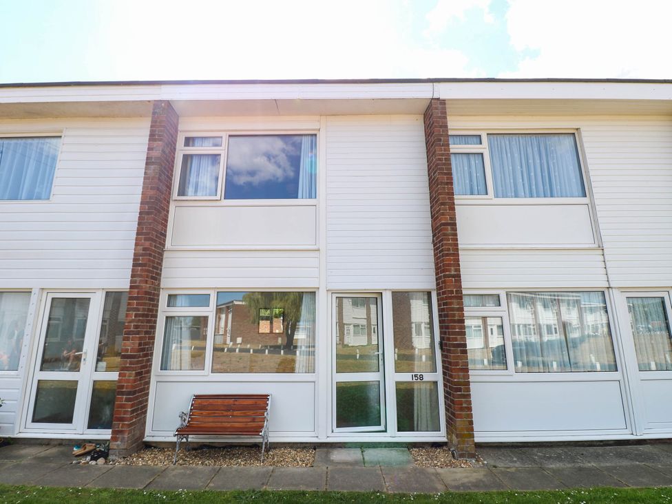 An exterior view of a building with windows and a door at 158 Beach Road Chalet Park